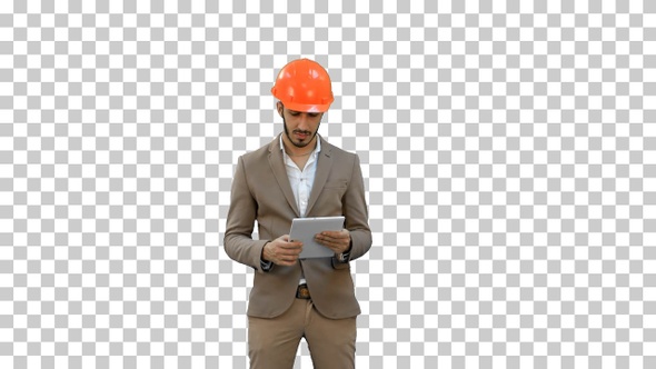 Young architect in helmet holding tablet, Alpha Channel