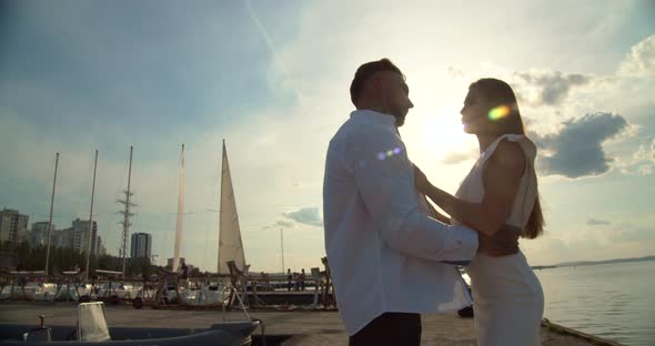 Romantic Couple Having Date on Embankment at Sunset