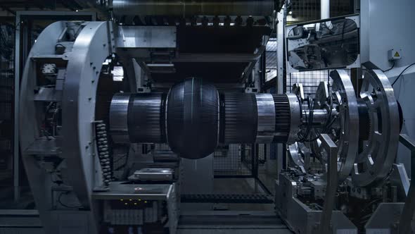 Tyre Production Machine Rotating in Technological Factory Stamping Product alt