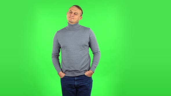 Male Daydreaming and Smiling Looking Up. Green Screen alt