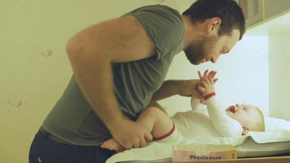 Father playing with baby boy