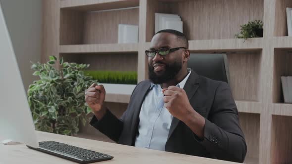 Expressive Senior Executive Shows His Positive Emotions Looking at the Scree alt