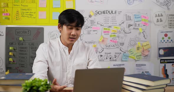 Businessman presentation meeting online via laptop alt