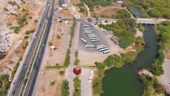 Close-up Flight Next To the Uphill Funicular with the Coast in the Background  alt