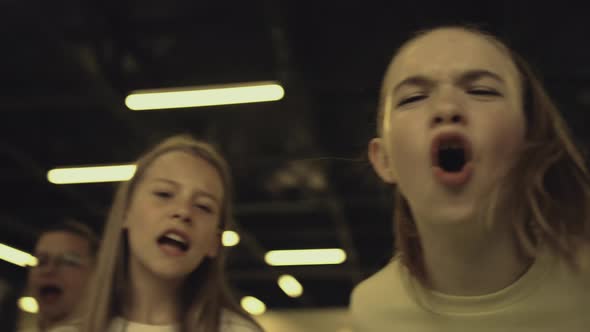 Shouting Pupils Teasing Schoolchild in School Hall Close Up alt