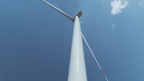 Motion Past Wind Turbine with Large Rotating Propeller