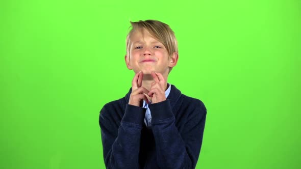 Baby Crosses His Fingers in His Arms. Green Screen. Slow Motion alt