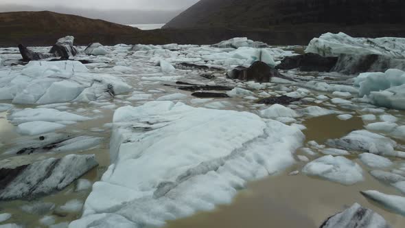 Flying Over the Icebergs Near Glacier Tongue End alt