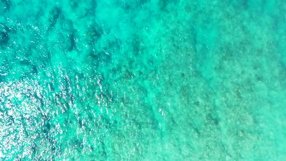 Aerial drone view travel of relaxing resort beach voyage by shallow sea with white sandy background  alt