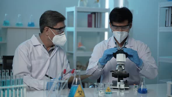 doctor scientist has researching a vaccine in the laboratory, meeting and writing analysis results alt