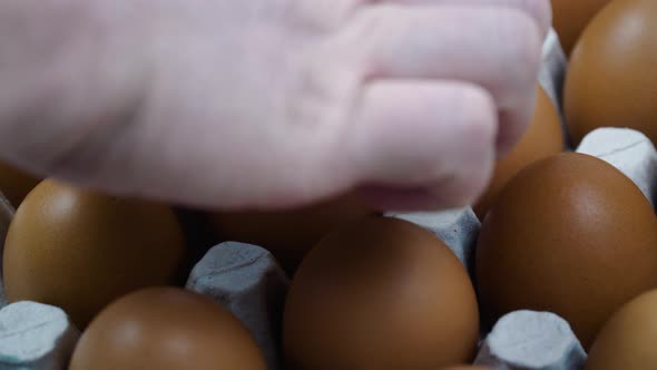 Hand Changes the Broken Egg to the Whole Egg on Platform  Close Up alt