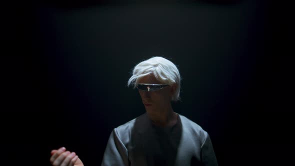 Guy Touching Virtual Objects in Futuristic Glasses alt