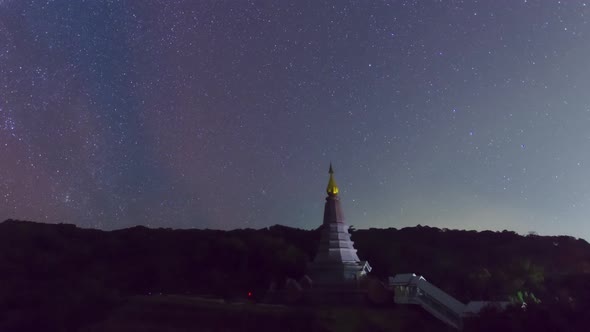 Starry night moving over a sacred temple at Doi Inthanon National Park