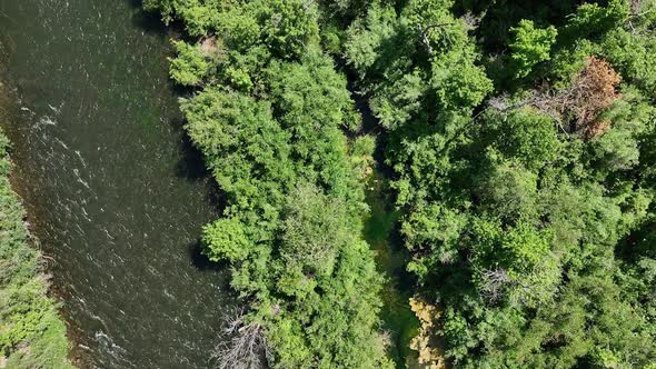 Aerial view looking down at the Provo River as people raft down it alt