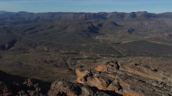 Drone shot of Cederberg near Cape Town - drone is panning facing the Cederberg valley. Snippet could alt