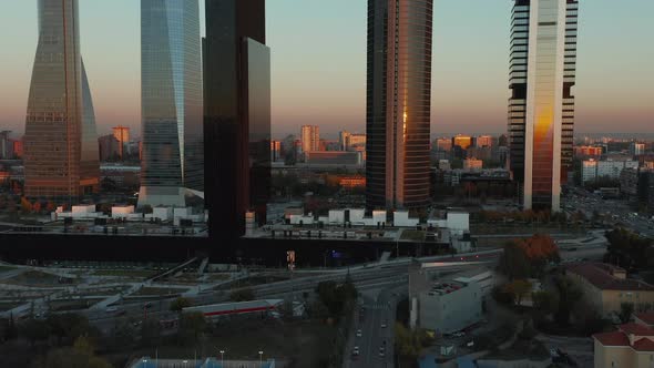 Forwards Fly Towards Modern Skyscrapers in Cuatro Torres Business Area at Sunset Time alt