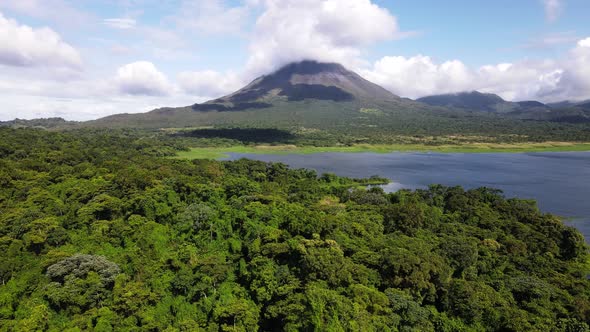Largest lake of Costa Rica in front of Arenal volcano. Aerial footage of a world famous landmark in alt