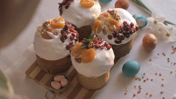Preparing Easter cakes. Decoration sweet dry fruits. Happy Easter
