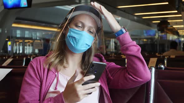 Woman in Medical Mask and Face Shield in Airport