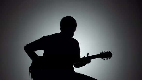 Silhouette of a Man with an Electric Guitar, Stock Footage | VideoHive