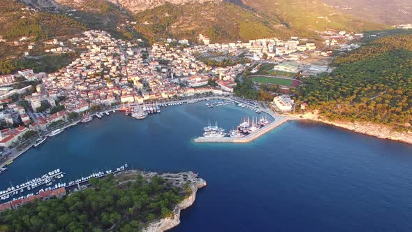 Aerial view of dalmatian bay with houses and football stadium alt