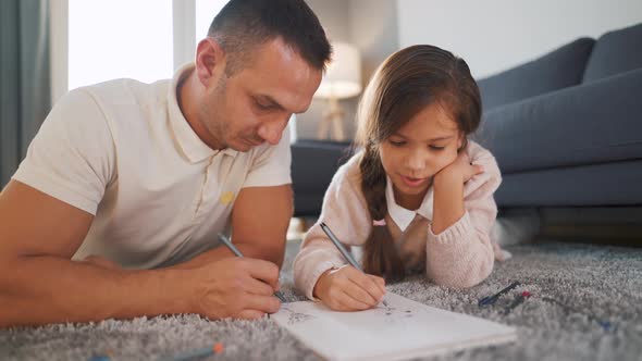 Father and Daughter Communicate Having Fun and Painting Together alt
