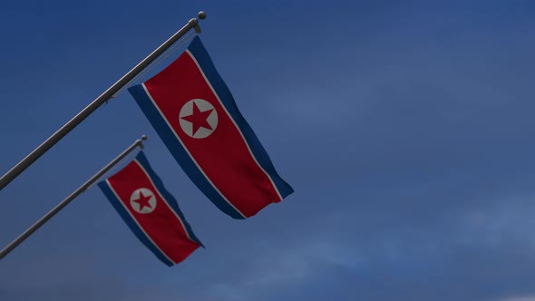 North Korea  Flags In The Blue Sky - 4K