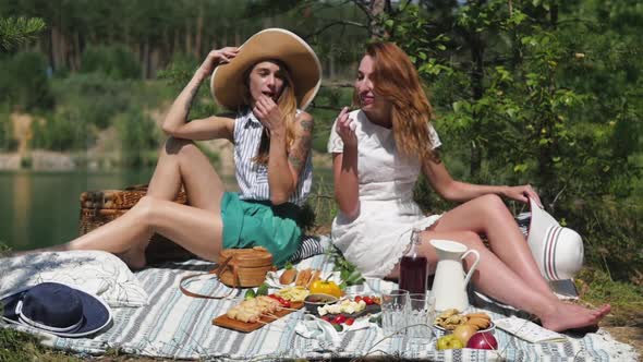 Summertime Picnic Setting on the Grass with Open Picnic Basket Fruit Salad and Cherry Pie alt