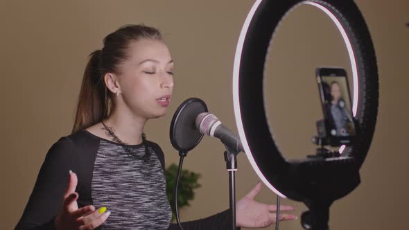 Beautiful Vocal Performer Singing Song in Microphone, Recording Music Tutorial