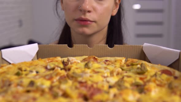 Sad Hungry Woman Looking at Pizza