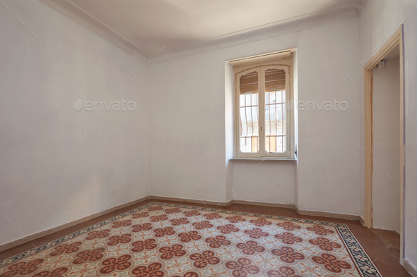 Old, empty room interior with tiled, decorated floor Stock Photo by andreahast