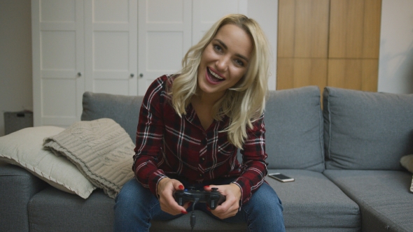 Cheerful Woman Playing Video Game