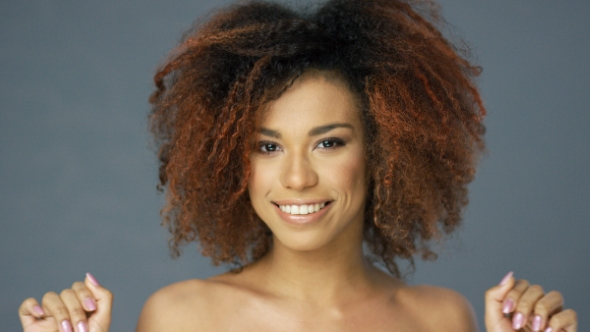 Cheerful Ethnic Woman with Hands Up alt