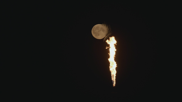 Full Moon Near the Burning Gas at the Chemical Plant