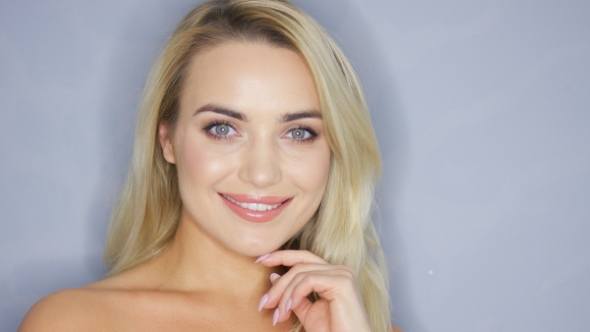 Smiling Blonde Model in Studio alt