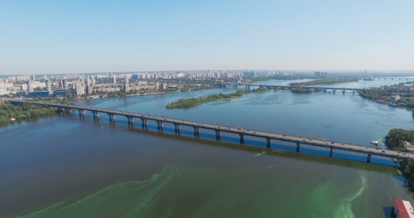 Kiev, Ukraine. Aerial View of Road Bridge - Moscow Bridge Over Dnieper River. Sunset in Kyiv