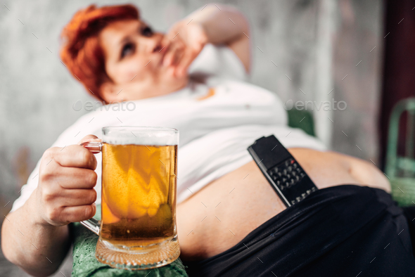 Overweight woman with glass of beer, obesity - Stock Photo - Images