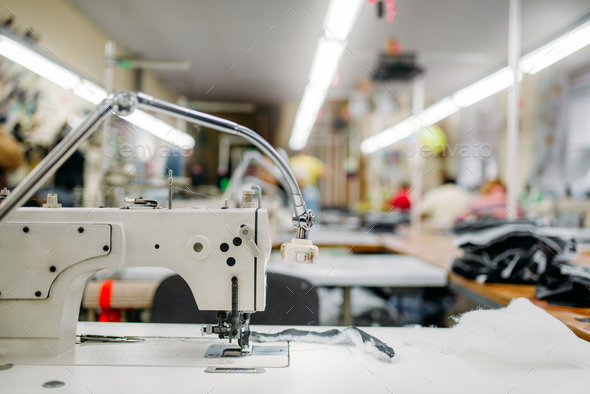 Sewing machine on clothing fabric, nobody - Stock Photo - Images