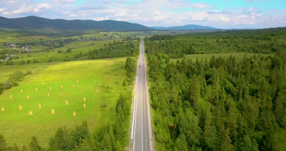 One Red Car Goes On The Road In The Mountains, Stock Footage 