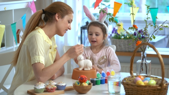 Mother and Her Little Daughter with Bunny Ears Painting Easter Bunny alt