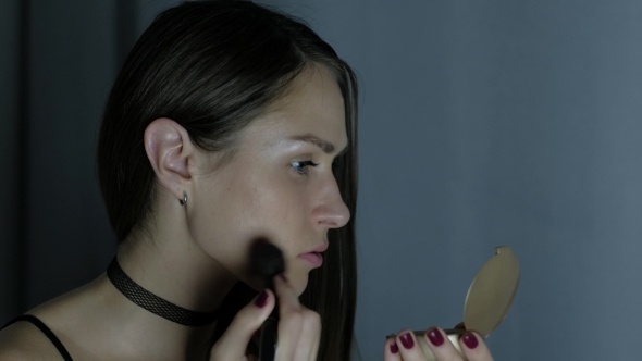 The Girl Putting on Makeup.