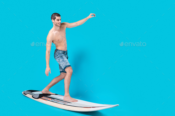 Surfer riding waves - Stock Photo - Images