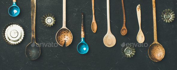Various vintage kitchen spoons and baking tin molds, top view Stock Photo by sonyakamoz
