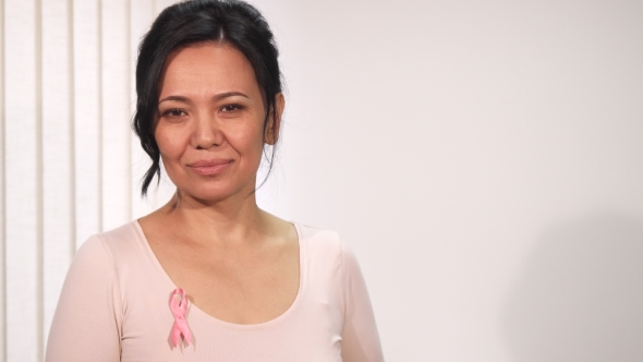 Gorgeous Happy Mature Asian Woman Smiling To the Camera alt