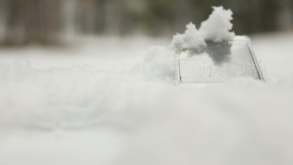 Lost Phone in the Snow In Background Person Leaving It