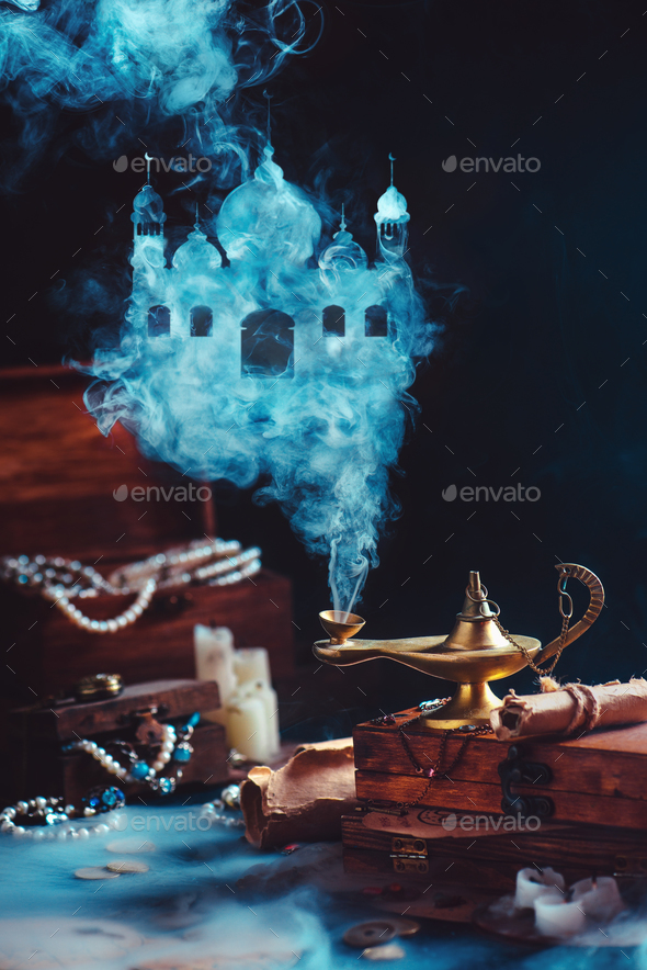 Magic lamp with mystic smoke forming an arabic castle, still life with treasure and jewelry. - Stock Photo - Images