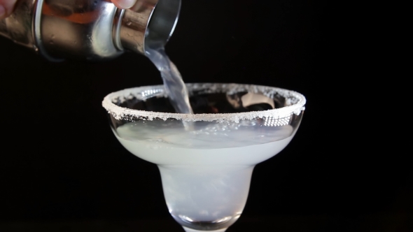 Process of Serving Margarita Cocktail ito a Glass