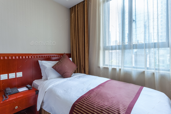 bed by the window - Stock Photo - Images