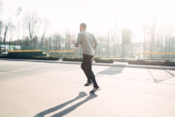 Runner in motion, speed running, healthy lifestyle - Stock Photo - Images
