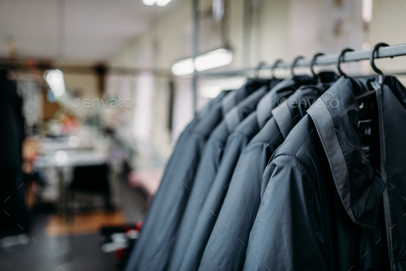 Row of jackets on hangers, clothing store, fabric Stock Photo by